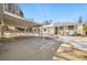 A spacious backyard featuring a covered patio, partial fencing and wintery landscape at 4100 Fenton St, Denver, CO 80212