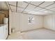 Unfinished basement with painted walls and a window, offering potential for customization at 4100 Fenton St, Denver, CO 80212