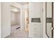 Hallway with bedroom and bathroom views featuring built in storage and neutral carpet at 4100 Fenton St, Denver, CO 80212