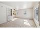 Bright living room with neutral carpet, built-in shelving, and lots of natural light at 4100 Fenton St, Denver, CO 80212