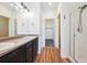 Bathroom featuring double sink vanity, shower, and lots of storage space at 16285 W 62Nd Ln # C, Arvada, CO 80403