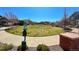 Expansive green space with walking paths and pet waste station within a welcoming community at 16285 W 62Nd Ln # C, Arvada, CO 80403