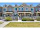 Charming townhome with a well-manicured lawn and white picket fence, offering curb appeal at 16285 W 62Nd Ln # C, Arvada, CO 80403