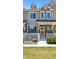 Charming townhome with a white picket fence and a well-manicured lawn at 16285 W 62Nd Ln # C, Arvada, CO 80403