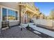 Charming brick townhome exterior with a covered porch, modern windows, and a well-maintained yard at 16285 W 62Nd Ln # C, Arvada, CO 80403