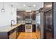 Well-equipped kitchen with stainless steel appliances, granite counters, and stylish cabinetry at 16285 W 62Nd Ln # C, Arvada, CO 80403