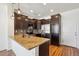 Charming kitchen featuring granite countertops, stainless steel appliances, and dark wood cabinetry at 16285 W 62Nd Ln # C, Arvada, CO 80403