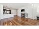 Spacious living room featuring hardwood floors and a cozy fireplace at 16285 W 62Nd Ln # C, Arvada, CO 80403