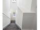 Bright staircase features carpeted steps and white walls at 16285 W 62Nd Ln # C, Arvada, CO 80403