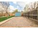 Shed and hammock in backyard featuring a gravel area, offering a tranquil retreat for relaxation and outdoor enjoyment at 1662 S Eudora St, Denver, CO 80222