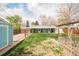Spacious backyard features a covered patio, hammock, and fenced garden, perfect for outdoor relaxation at 1662 S Eudora St, Denver, CO 80222