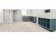 Spacious basement featuring neutral carpet, bright storage shelving and access to an open staircase at 1662 S Eudora St, Denver, CO 80222