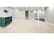 Spacious basement with carpet, neutral walls, and shelving offering versatility for various uses at 1662 S Eudora St, Denver, CO 80222