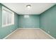 Neutral carpet and recessed lighting create a bright and versatile space, perfect for a home office or playroom at 1662 S Eudora St, Denver, CO 80222