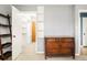 Bedroom with closet, featuring ladder shelves and wood dresser, and showing doorway to a large walk-in closet at 1662 S Eudora St, Denver, CO 80222