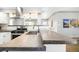 Sleek kitchen featuring modern appliances, stylish countertops, and a view into the open living area at 1662 S Eudora St, Denver, CO 80222