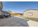 Spacious backyard featuring a concrete patio, wooden fence, and detached garage at 2448 S Galapago St, Denver, CO 80223