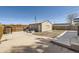 Detached garage and wooden fence line the backyard of this property at 2448 S Galapago St, Denver, CO 80223
