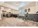 Spacious basement with carpeted floors, a window, and ample room for activities at 2448 S Galapago St, Denver, CO 80223