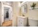 Bright bathroom featuring a modern sink vanity and a large mirror at 2448 S Galapago St, Denver, CO 80223