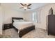 Comfortable bedroom with a ceiling fan, carpet, and a large window with natural light at 2448 S Galapago St, Denver, CO 80223