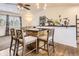 Cozy dining area with breakfast bar and three comfortable bar stools at 2448 S Galapago St, Denver, CO 80223