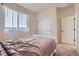 Cozy bedroom with carpet, neutral walls, and lots of natural light from the window at 24374 E 42Nd Ave, Aurora, CO 80019