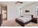 Bedroom with neutral walls and carpet, ceiling fan, and a bedside table at 24374 E 42Nd Ave, Aurora, CO 80019