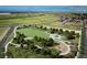 An aerial view of a park featuring walking trails, open fields, covered seating, and playgrounds at 24374 E 42Nd Ave, Aurora, CO 80019