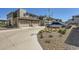 Three-car garage and driveway, offering ample parking space in front of a townhouse-style home at 24374 E 42Nd Ave, Aurora, CO 80019
