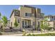 Beautiful townhome showcasing modern design, a welcoming front porch, and professional landscaping at 24374 E 42Nd Ave, Aurora, CO 80019
