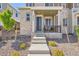 Inviting front porch with seating area, framed by a stone facade and landscaped garden at 24374 E 42Nd Ave, Aurora, CO 80019