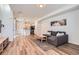 Open-concept living room and kitchen with modern finishes and plenty of natural light at 24374 E 42Nd Ave, Aurora, CO 80019