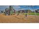 Children enjoy a modern playground featuring swings, slides, and climbing structures within the community at 24374 E 42Nd Ave, Aurora, CO 80019