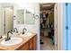 Updated bathroom features a double vanity, ample storage space, and a door to a walk-in closet at 992 Burning Bush Pt, Monument, CO 80132