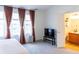 Spacious bedroom featuring a comfortable bed, windows, and an en-suite bathroom at 992 Burning Bush Pt, Monument, CO 80132