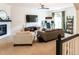 Bright living room with modern ceiling fan, entertainment center, and stylish decor create a comfortable space at 992 Burning Bush Pt, Monument, CO 80132