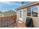 Relaxing back deck with a grill, patio furniture, and sunny views, perfect for outdoor entertaining at 4369 E 127Th Way, Thornton, CO 80241