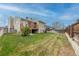 Expansive backyard featuring a well-maintained lawn and inviting wooden deck perfect for outdoor relaxation at 4369 E 127Th Way, Thornton, CO 80241