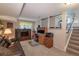 Inviting basement with a cozy entertainment area, office space, and convenient stairway access at 4369 E 127Th Way, Thornton, CO 80241