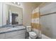 Bathroom with granite countertop, vanity, and shower-tub combo at 15476 W 64Th Loop # C, Arvada, CO 80007