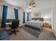Bedroom with a large bed, modern decor, and a work space with dual monitors at 15476 W 64Th Loop # C, Arvada, CO 80007