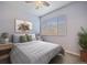 Well-lit bedroom with neutral tones, a ceiling fan, and large window at 15476 W 64Th Loop # C, Arvada, CO 80007