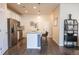 Modern kitchen boasts stainless steel appliances, stone countertops, and a breakfast bar with stylish seating at 15476 W 64Th Loop # C, Arvada, CO 80007