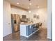 Modern kitchen features stainless steel appliances, granite countertops, and an island with seating at 15476 W 64Th Loop # C, Arvada, CO 80007