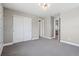 A bedroom with a double door closet and a door that leads to the bathroom at 8846 Yates Dr, Westminster, CO 80031