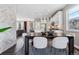 Dining area next to the kitchen featuring modern table, chairs, and stylish lighting at 8846 Yates Dr, Westminster, CO 80031