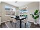 Dining area with large windows offering great natural light and neighborhood views at 8846 Yates Dr, Westminster, CO 80031