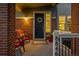 Welcoming front porch with decorative wreath, red chairs, flower pot, and house number visible at 8846 Yates Dr, Westminster, CO 80031