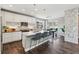 Eat-in kitchen features sleek countertops, pendant lighting, and seamless access to dining area at 8846 Yates Dr, Westminster, CO 80031